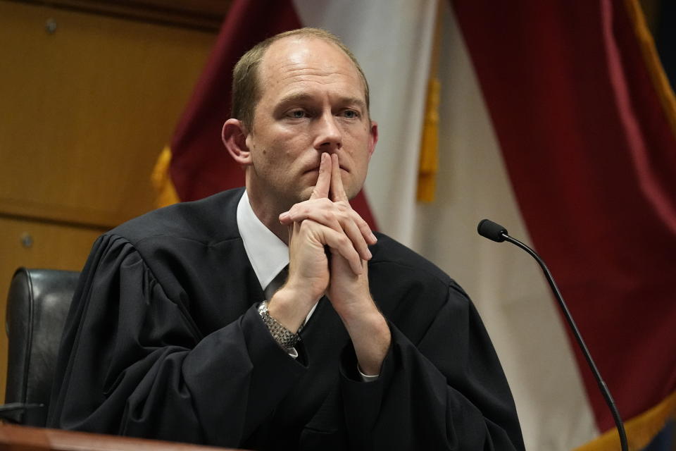 FILE - Fulton County Superior Judge Scott McAfee presides in court, Feb. 27, 2024, in Atlanta. The judge overseeing the Georgia election interference case has dismissed some of the charges against ex-President Donald Trump, but others remain. Judge McAfee wrote Wednesday in an order that six of the charges in the indictment must be quashed, including three against Trump. (AP Photo/Brynn Anderson, Pool, File)