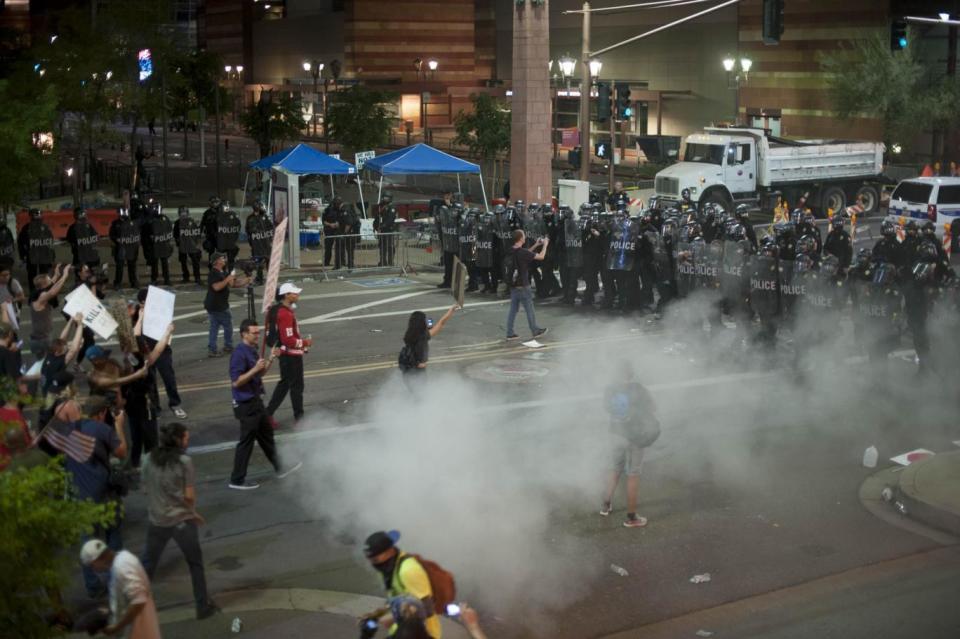 Face-off: Protesters and police during the clashes in Arizona