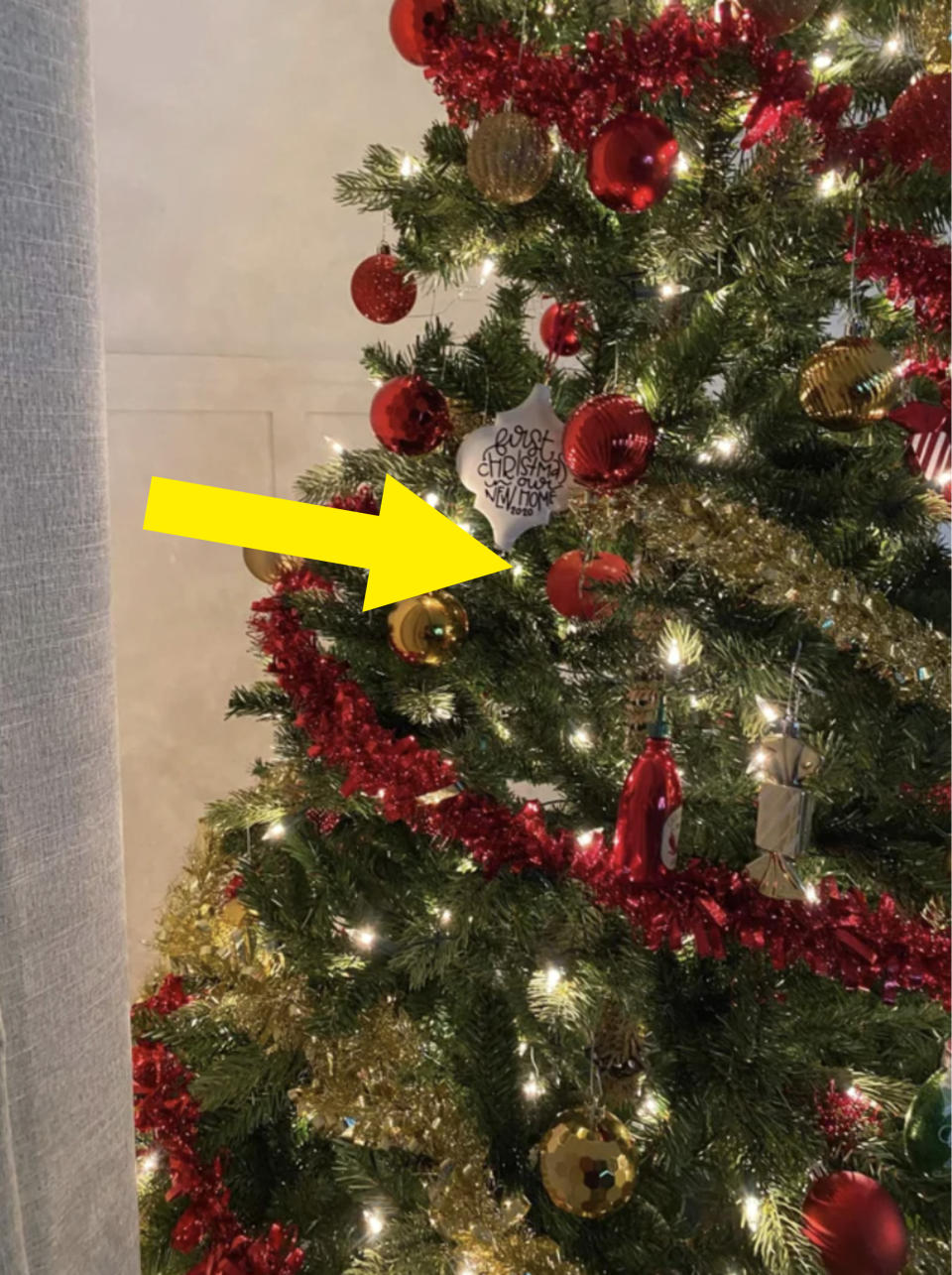 tomato amongst red ornaments on a Christmas tree