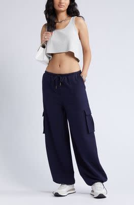 A pair of baggy cargo pants with an adjustable hem