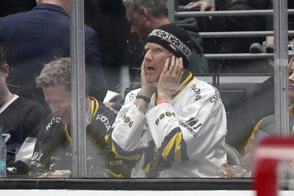 Actor Will Ferrell covers his ears as the crowd is asked to make noise during the first period in Game 4 of an NHL hockey Stanley Cup first-round playoff series between the Los Angeles Kings and the Edmonton Oilers Sunday, April 28, 2024, in Los Angeles. (AP Photo/Mark J. Terrill)