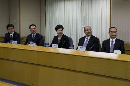 (L - R) Hong Kong's Chief Executive Office director Edward Yau, Secretary for Justice Rimsky Yuen, Chief Secretary for Administration Carrie Lam, Secretary for Constitutional and Mainland Affairs Raymond Tam and Undersecretary for Constitutional and Mainland Affairs Lau Kong-wah attend a meeting with Hong Kong Federation of Students (HKFS) in Hong Kong October 21,2014. REUTERS/Tyrone Siu