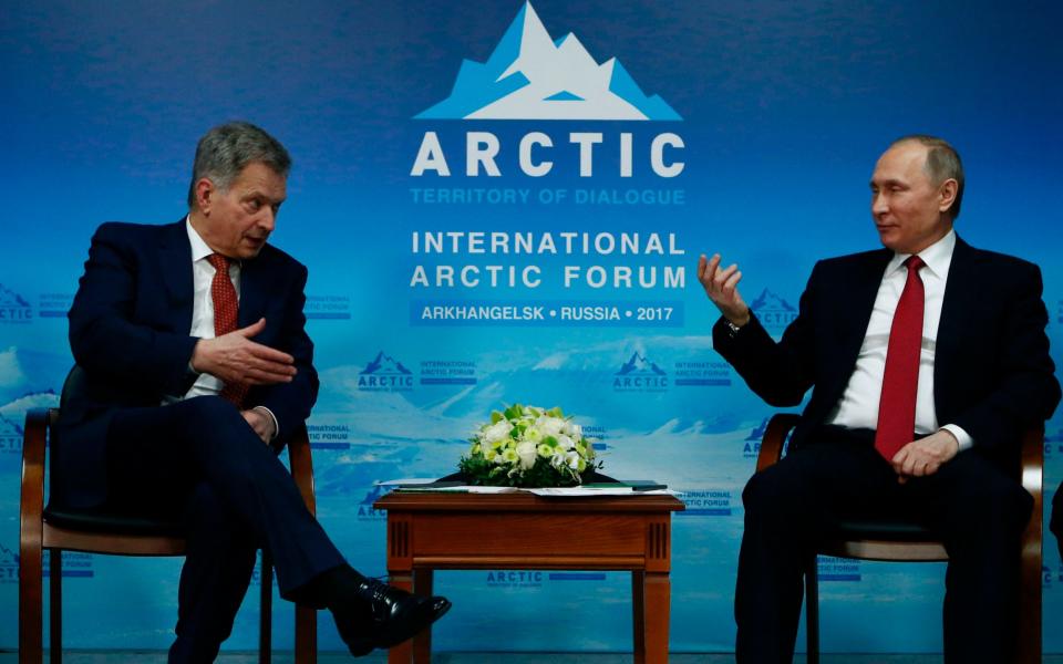 Vladimir Putin (R) with Finnish President Sauli Niinisto during the International Arctic Forum in Arkhangelsk - Credit: SERGEI KARPUKHIN/AFP