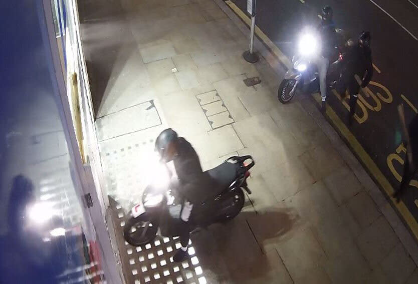 CCTV video grab issued by the Metropolitan Police of a moped gang during a Kensington High Street ram raid, the gang have been jailed for a string of bold "professional, planned and organised" high profile raids across London. (PA)