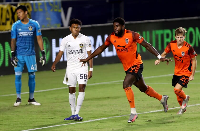 Orange County Soccer Club forward Sean Okoli celebrates scoring the first goal of the game.