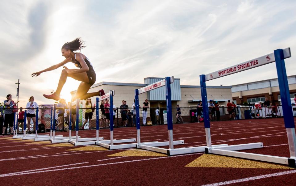 Padua's Taliah Cintron leaps a hurdle on her way to a first place finish in the Girls 300 Meter Hurdles event at the Meet of Champions at Dover High School in 2016.