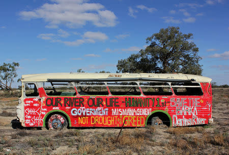 A rusted-out old bus painted by protesters campaigning against irrigator allocations from the Darling River is pictured at Menindee in western New South Wales, Australia, April 26, 2019. REUTERS/Tom Westbrook