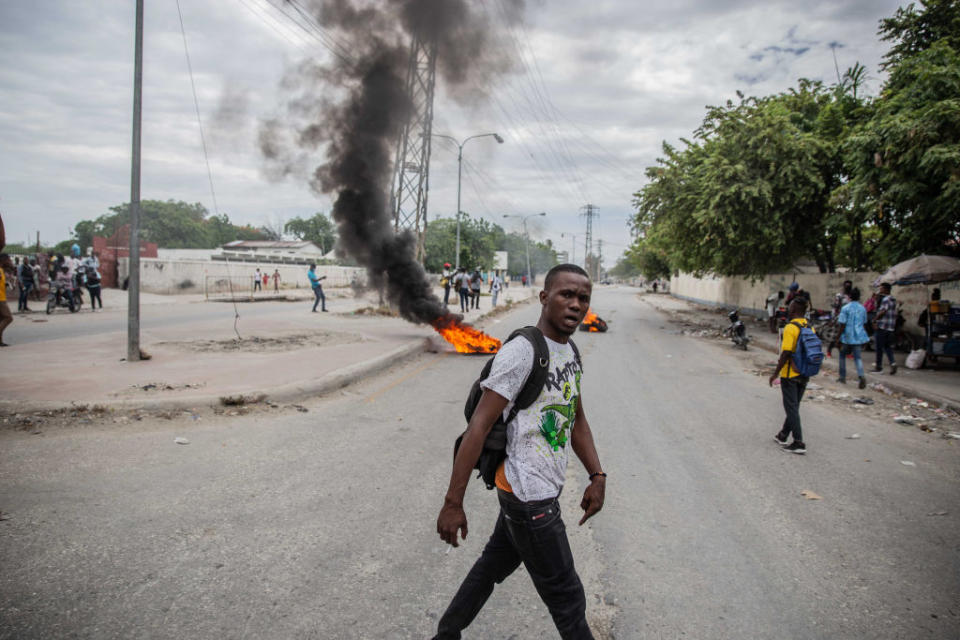 Supporters of political leaders being questioned by authorites protest in the street. Source: Getty