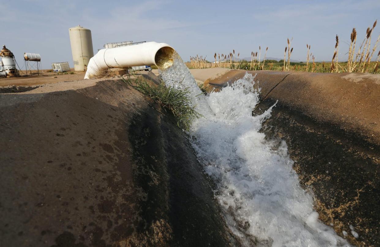 <span class="caption">Water flows into a canal that feeds farms in Casa Grande, Ariz.</span> <span class="attribution"><a class="link " href="https://newsroom.ap.org/detail/ColoradoRiver-Drought-Farmers/829f1440d70544f59500b090305b8d7a/photo" rel="nofollow noopener" target="_blank" data-ylk="slk:AP Photo/Darryl Webb;elm:context_link;itc:0;sec:content-canvas">AP Photo/Darryl Webb</a></span>