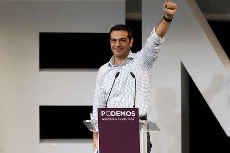 Alexis Tsipras, leader of Greece's Syriza party, gestures during a meeting in central Madrid November 15, 2014. REUTERS/Juan Medina