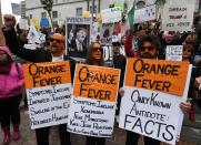 <p>Protesters carry anti-Trump signs during a ‘Not My President’s Day’ demonstration outside City Hall in Los Angeles, Calif., on Feb. 20, 2017. (Mark Ralston/AFP/Getty Images) </p>