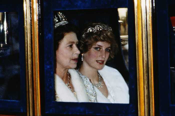 The Princess of Wales and the Queen attend the Opening of Parliament in London, November 1982. Diana is wearing a white fur coat and the Spencer tiara. (Photo by Terry Fincher/Princess Diana Archive/Getty Images)