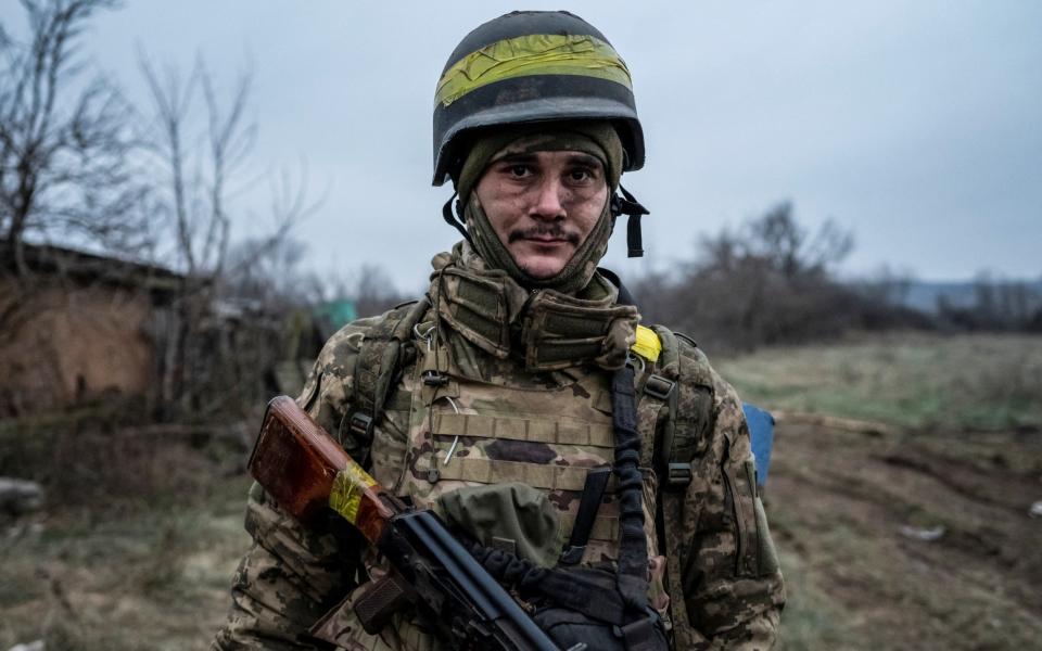 A serviceman of the Carpathian Sich Battalion is seen at his position on a frontline - REUTERS/Viacheslav Ratynskyi