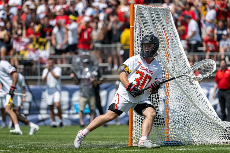 Maryland goalie Logan McNaney (30) runs with the ball after a save against Cornell during the 2022 Division I men's lacrosse championship at Pratt & Whitney Stadium in East Hartford, Connecticut.