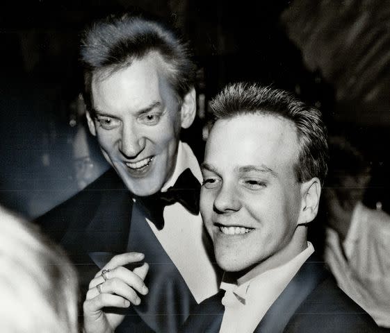 <p>Jim Russell/Toronto Star via Getty</p> Donald Sutherland and Kiefer Sutherland in 1984