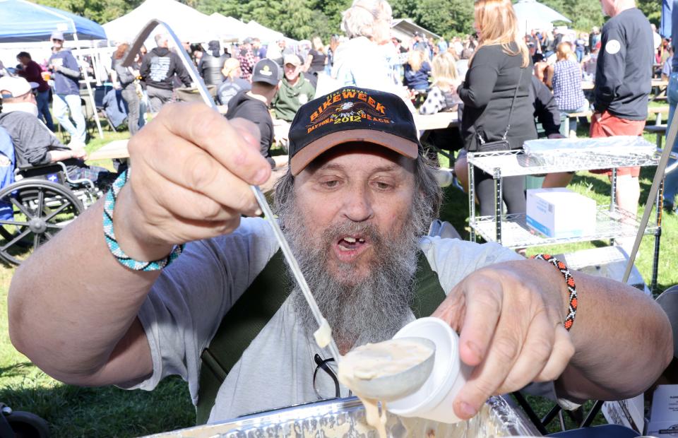Higgin Smith pours a cup of shrimp chowder during the 27th annual ChiliChowda Fest at the East Bridgewater Commercial Club on Saturday, Sept. 24, 2022.