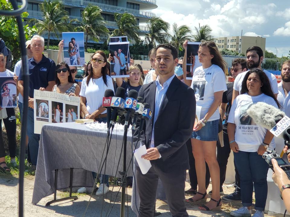 Martin Langesfeld, whose sister Nicole Langesfeld, 26, and brother-in-law Luis Sadovnic, 25, were both killed in the Champlain Towers South collapse, speaks at a press conference in Surfside, Fla. in favor of a monument to be built on the site. Sept. 23, 2021.