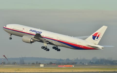 The Malaysia Airlines Boeing 777-200ER that disappeared from air traffic control screens on March 8, 2014, taking off from Roissy-Charles de Gaulle Airport in France. - Credit: &nbsp;Laurent Errera/AP