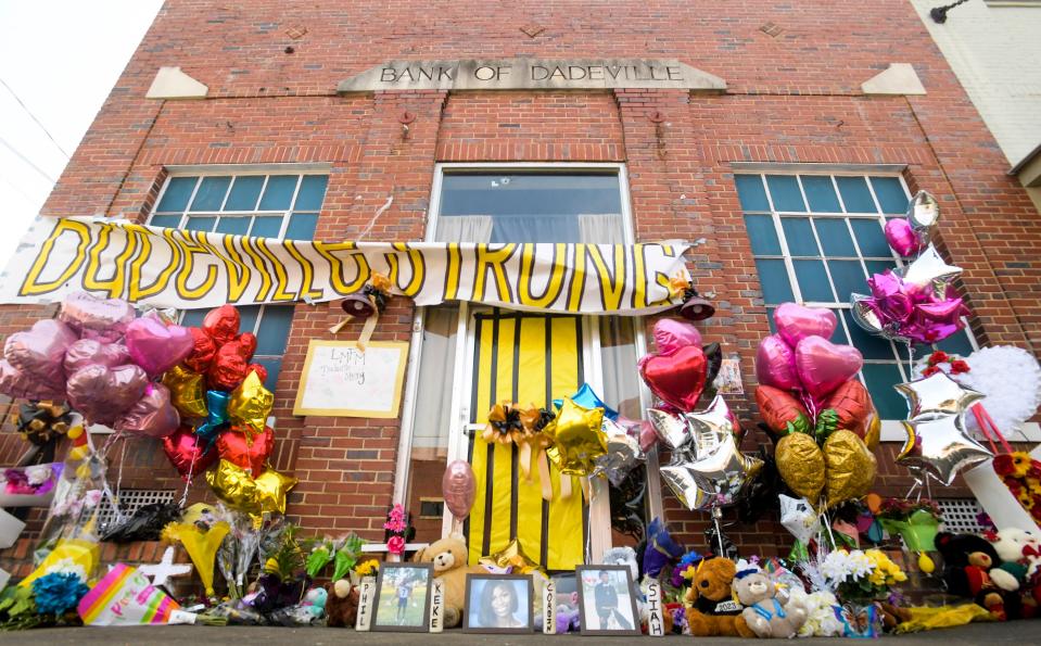 The makeshift memorial to those killed and injured is seen at the site of the fatal shooting in Dadeville, Ala., on Friday April 21, 2023. 