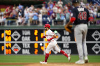 Philadelphia Phillies' Kyle Schwarber, left, rounds the bases after hitting a home run against Washington Nationals pitcher Josiah Gray during the fourth inning of a baseball game, Wednesday, July 6, 2022, in Philadelphia. (AP Photo/Matt Slocum)