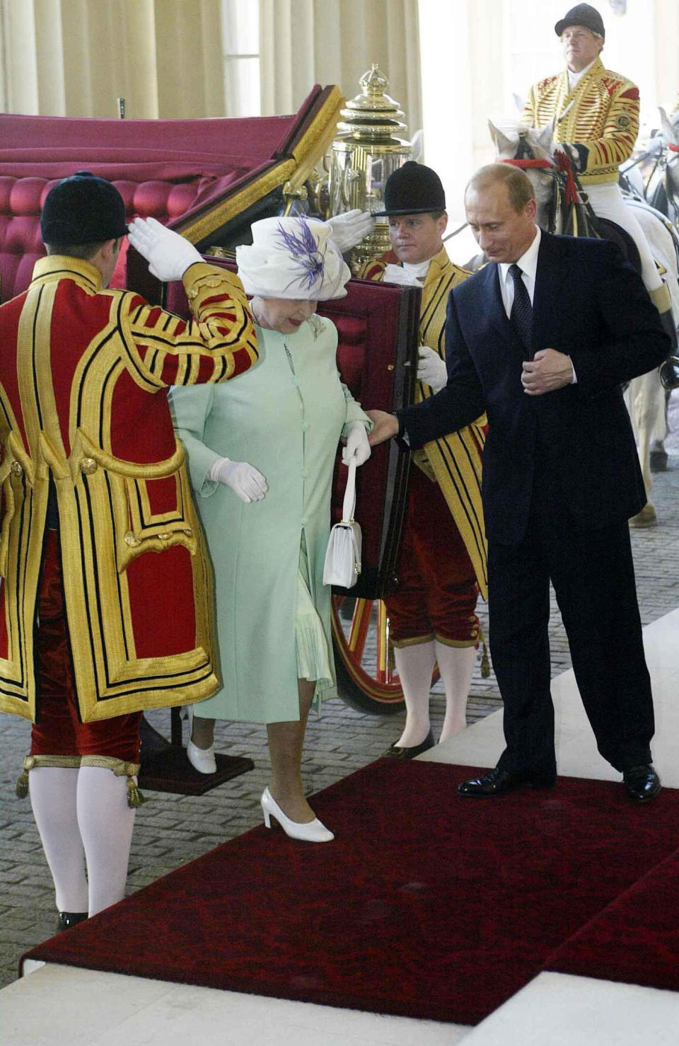 Britain's Queen Elizabeth II and Russian President Vladimir Putin arrive at Buckingham Palace, London, on the first day of his state visit. It is the first state visit by a Russian leader since the days of the Tsars.  