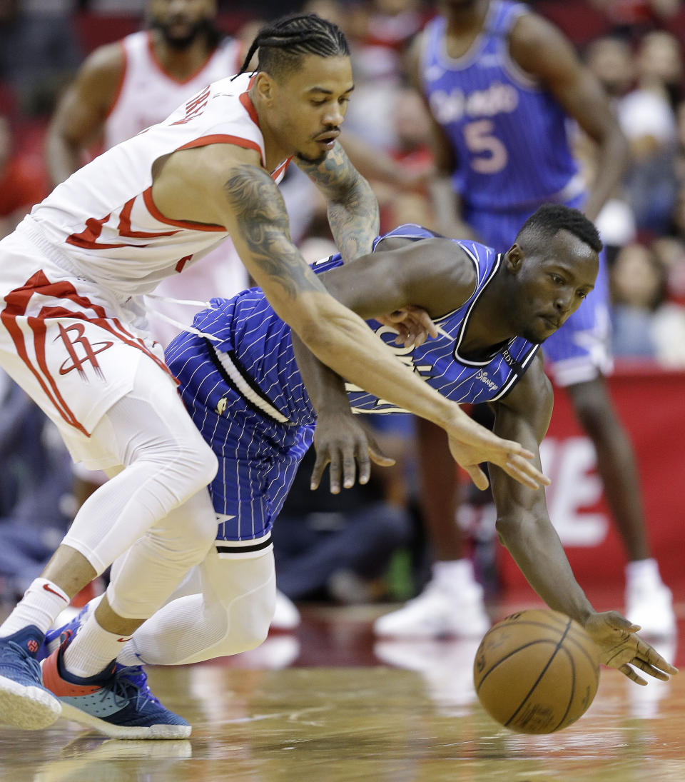 Orlando Magic guard Jerian Grant, right, and Houston Rockets guard Gerald Green chase a loose ball during the first half of an NBA basketball game, Sunday, Jan. 27, 2019, in Houston. (AP Photo/Eric Christian Smith)