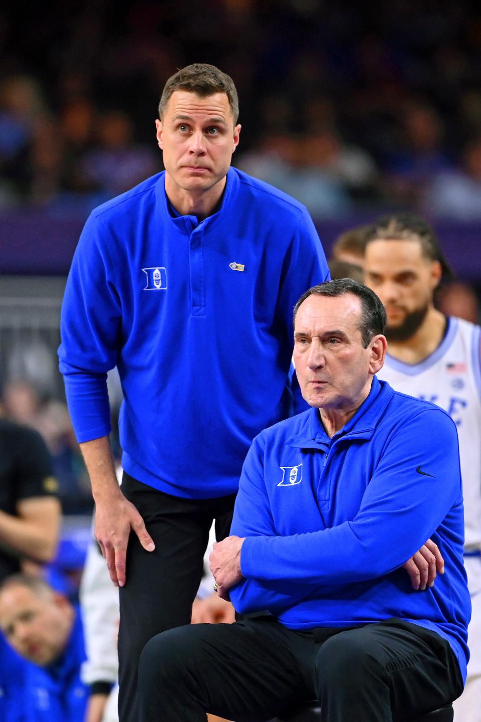 Duke former coach Mike Krzyzewski and new head coach Jon Scheyer watch their team play against the North Carolina Tar Heels.