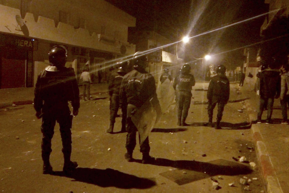 Tunisian Police officers patrol after clashes in the streets of Kasserine, southern of Tunisia, Tuesday, Dec 25, 2018.The death of a Tunisian journalist Abderrak Zorgui who set himself on fire to protest economic problems in the North African nation prompted a protest that led to clashes with police and nationwide concern. (AP Photo/Mohamed Ben Salah)