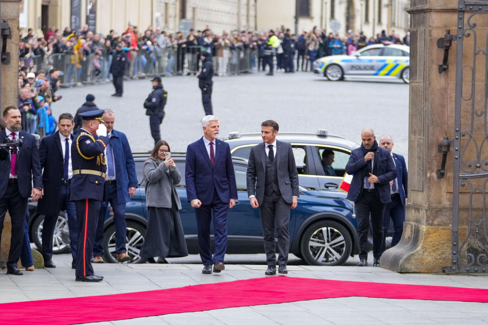 Czech Republic's President Petr Pavel, center left, welcomes his French counterpart Emmanuel Macron at the Prague Castle in Prague, Czech Republic, Tuesday, March 5, 2024. Macron is on a one-day official visit to Czech Republic. (AP Photo/Petr David Josek)