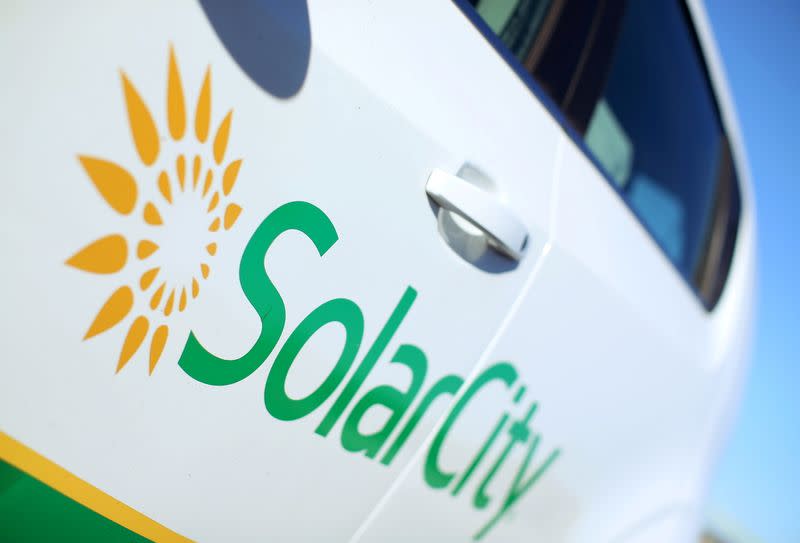 FILE PHOTO: A Solar City logo is seen on the side of a company vehicle in San Diego, California