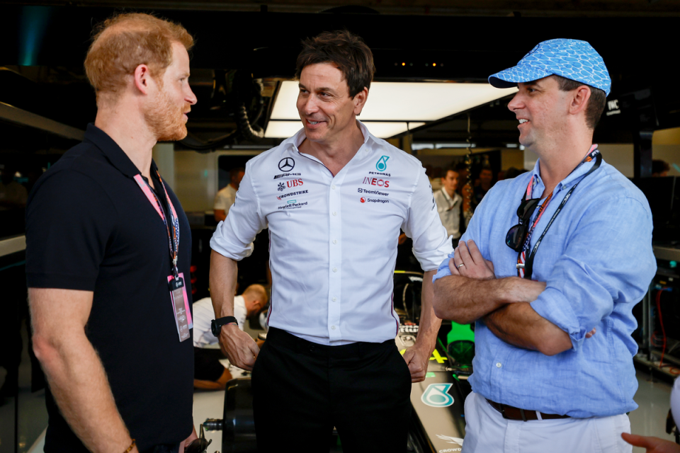 Harry chatted away to executives at Mercedes. (Getty Images)