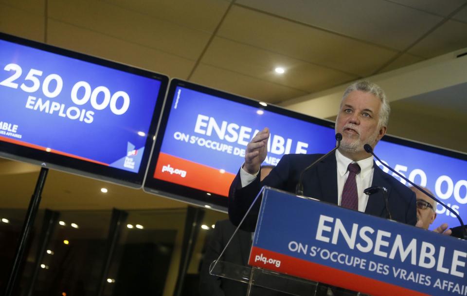 Liberal leader Couillard gestures during campaign stop in Montreal