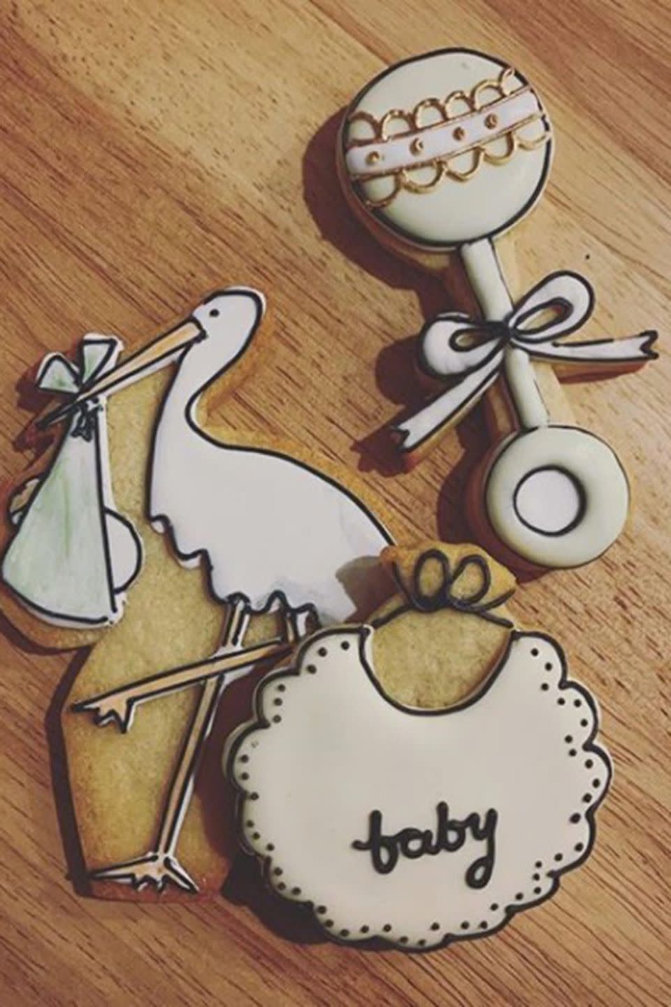 Cute baby-themed biscuits from the celebration, pictured by Meghan's makeup artist, Daniel Martin