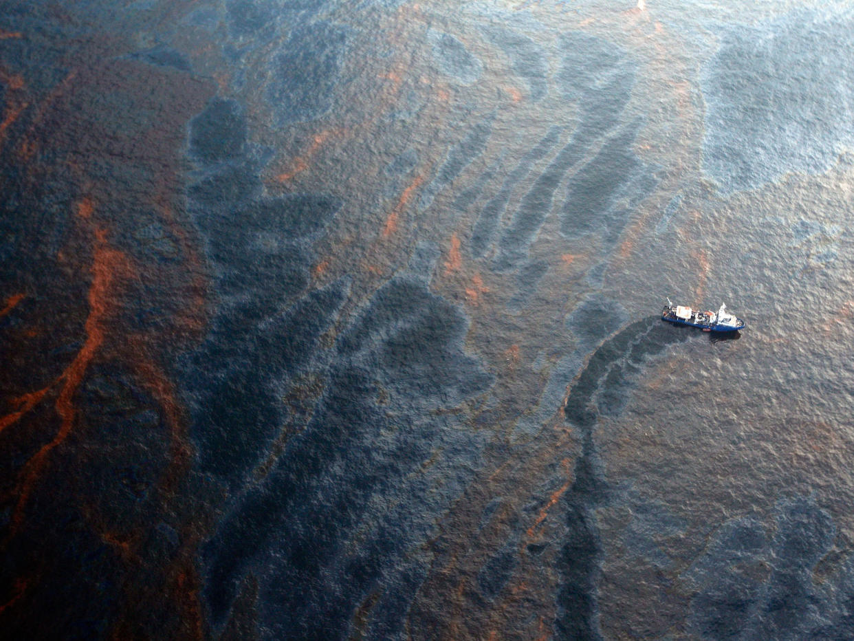 A boat works to collect oil that has leaked from the Deepwater Horizon wellhead in the Gulf of Mexico: Getty