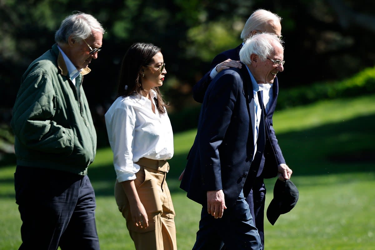 WASHINGTON, DC - APRIL 22: U.S. President Joe Biden (R), Sen. Bernie Sanders (I-VT), Sen. Ed Markey (D-MA) (L) and Rep. Alexandria Ocasio Cortez (D-NY) walk to the Oval Office after returning to the White House on April 22, 2024 in Washington, DC. Biden and the members of Congress returned to the White House following an Earth Day event in Virginia. (Photo by Chip Somodevilla/Getty Images) (Getty Images)