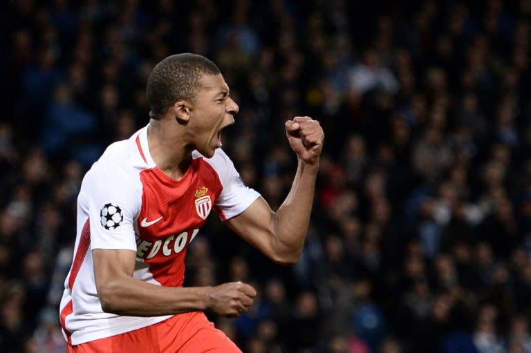 Monaco's forward Kylian Mbappe Lottin celebrates scoring with defender Benjamin Mendy during the Champions League football match against Manchester City February 21, 2017