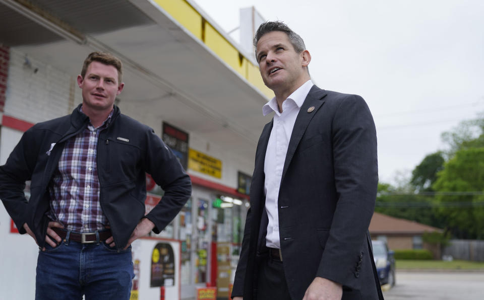 Rep. Adam Kinzinger, R-Ill., right, stands with Texas congressional candidate Michael Wood after they met for lunch, Tuesday, April 27, 2021, in Arlington, Texas. Wood is considered the anti-Trump Republican Texas congressional candidate that Kinzinger has endorsed in the May 1st special election for the 6th Congressional District. (AP Photo/LM Otero)