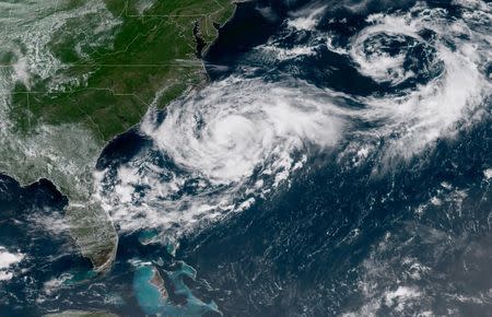 Tropical Storm Chris is shown off the eastern coast of North and South Carolina, U.S., in this satellite image July 9, 2018 at 16:12 UTC. NOAA/Goes-East Imagery/Handout via REUTERS