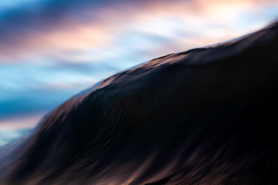 The vibrant color of this wave perfectly mirrors the sky—a harmonious blend of nature's palette.<p>Marcus Paladino</p>