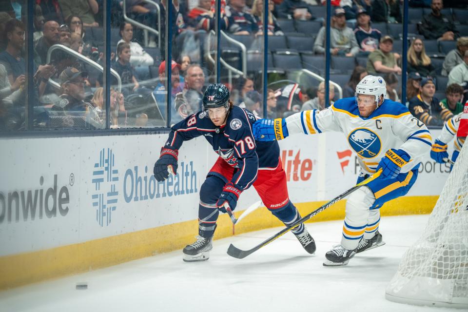 Oct 4, 2023; Columbus, Ohio, United States;
Columbus Blue Jackets defenseman Damon Severson (78) fights for the puck against Buffalo Sabres goaltender Devon Levi (27) during their game on Wednesday, Oct. 4, 2023 at Nationwide Arena.