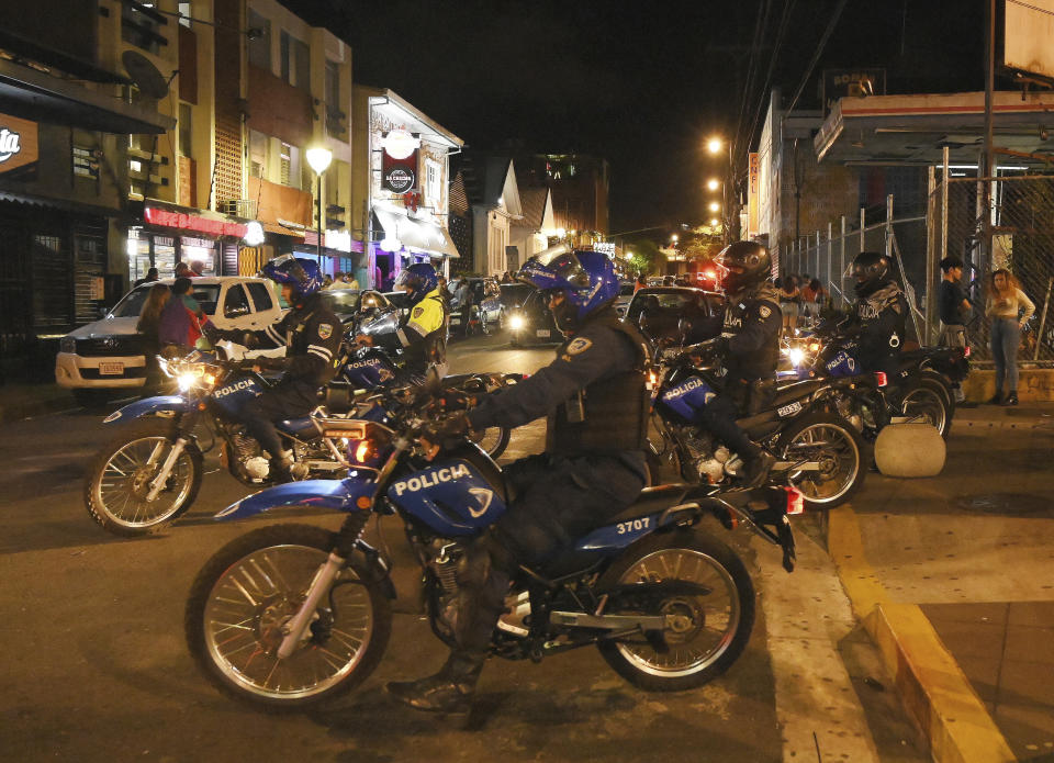 FILE - Police officers patrol in the nightclubs and bar zone of San Jose, Costa Rica, Jan 27, 2023. According to authorities, the Central American nation has reached its highest murder rate since the Organization of Judicial Investigation office has kept records. (AP Photo/Carlos Gonzalez/File)