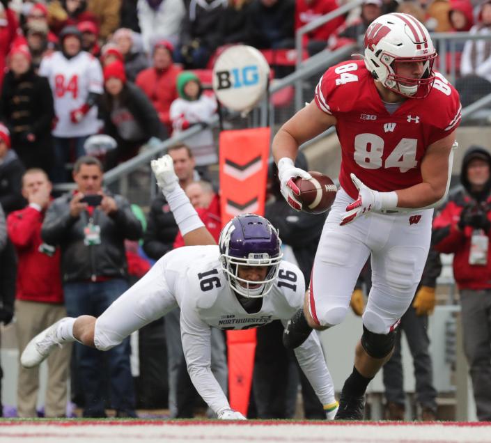 Wisconsin&#39;s Jake Ferguson catches an 11-yard touchdown pass during the third quarter of their game on Nov. 13 at Camp Randall Stadium.  Ferguson was named first-team all-Big Ten.