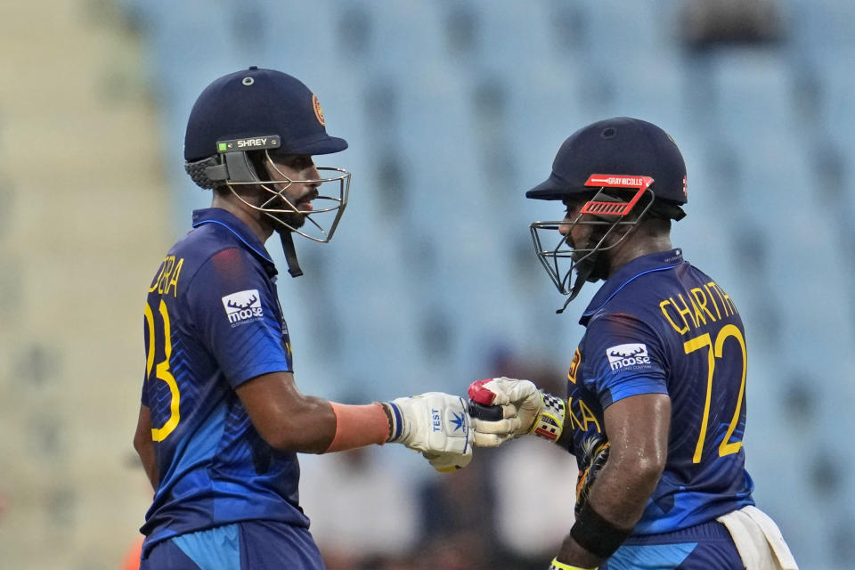 Sri Lanka's Charith Asalanka, right, and Sadeera Samarawickrama encourage each other during the ICC Men's Cricket World Cup match between Sri Lanka and Netherlands in Lucknow, India, Saturday, Oct. 21, 2023. (AP Photo/Altaf Qadri)