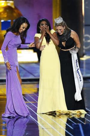 Miss America contestant, Miss New York Nina Davuluri (C) reacts with runner-up Miss California Crystal Lee (L) and 2013 Miss America Mallory Hagan after being chosen winner of the 2014 Miss America Pageant in Atlantic City, New Jersey, September 15, 2013. REUTERS/Lucas Jackson