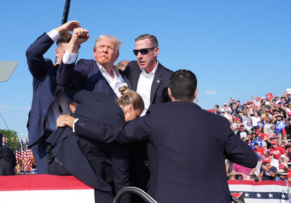 BUTLER, PENNSYLVANIA - July 13: Former president Donald Trump raises his arm with blood on his face during a campaign rally for former President Donald Trump at Butler Farm Show Inc. on Saturday, July 13, 2024 in Butler, Pa. Trump ducked and was taken offstage after loud noises were heard after he began speaking. 
(Photo by Jabin Botsford/The Washington Post via Getty Images)