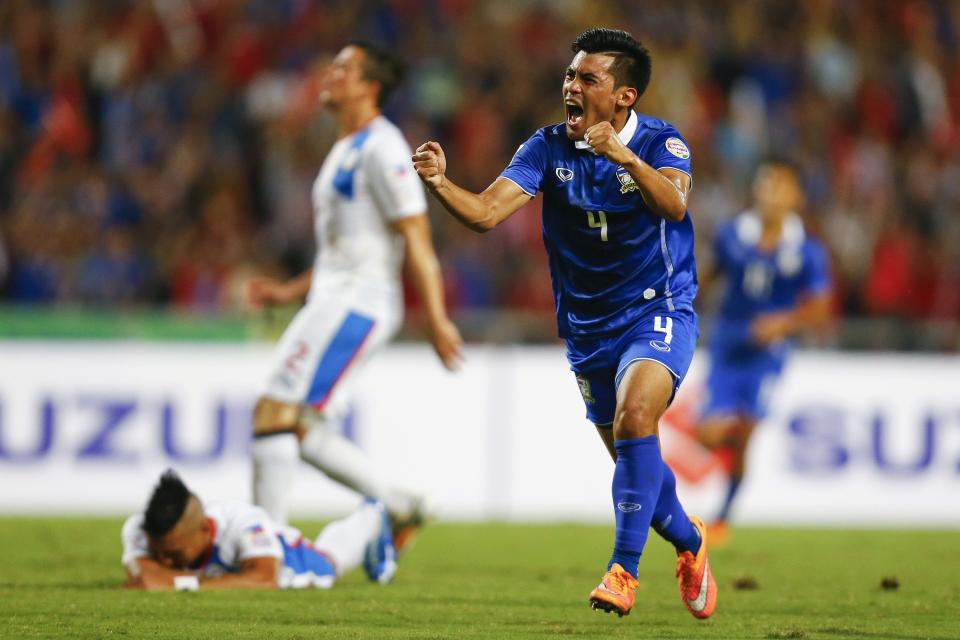 Kroekrit Thawikan (R) of Thailand celebrates scoring against Philippines during their second leg semi final match of AFF Suzuki Cup 2014 in Bangkok December 10, 2014. REUTERS/Damir Sagolj (THAILAND - Tags: SPORT SOCCER)