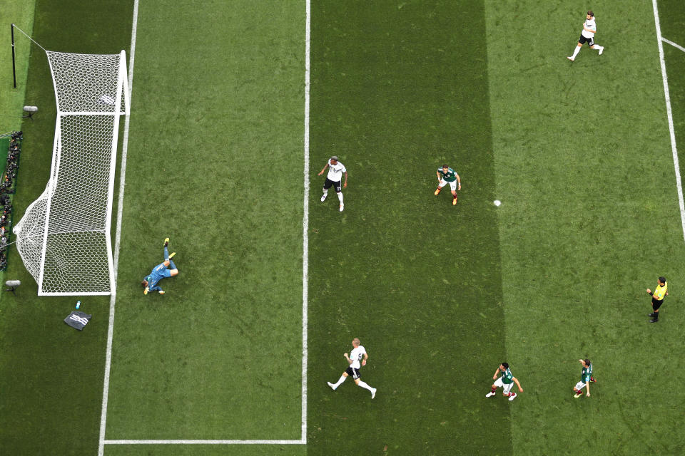 <p>Hirving Lozano of Mexico scores his team’s first goal under pressure from Toni Kroos of Germany during the 2018 FIFA World Cup Russia group F match between Germany and Mexico at Luzhniki Stadium on June 17, 2018 in Moscow, Russia. (Photo by Dan Mullan/REMOTE/Getty Images) </p>