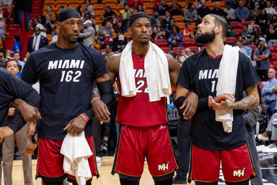 Miami Heat players Jimmy Butler, Bam Adebayo and Caleb Martin stand among the more than 162 Black men on the court to represent the 162 Black men that voted to incorporate the City of Miami in 1896 during a halftime show during an NBA game at Kaseya Center in Miami, Florida, on Wednesday, February 7, 2024.