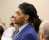 Former Virginia Tech football player Isimemen David Etute listens during his trial in Montgomery County Circuit Court in Christiansburg, Va., Wednesday, May 25, 2022. Etute is accused of fatally beating Jerry Smith, 40 in May 2021, a man he met on an online dating site and had initially believed to be a woman. (Matt Gentry/The Roanoke Times via AP, Pool)