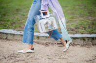 <p>Aimee Song carries “Madame Bovary” inside a clear Staud tote. (Photo: Getty Images) </p>